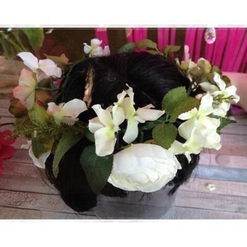 This artificial flower crown is perfect for Prom Parties or Festivals. The flowers are arranged so they go right around your head and can be adjusted to fit you head size. Adult Size.